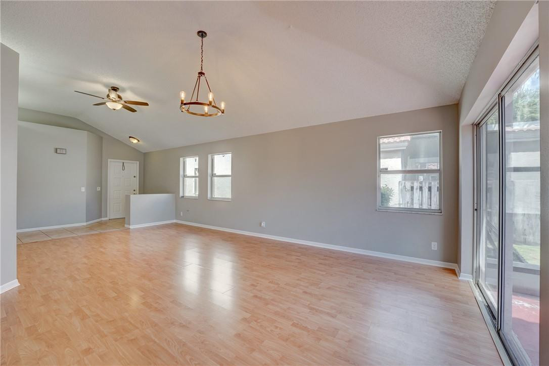Undisclosed Address Davie, FL 33328 - Photo 10 of 24 a view of empty room with wooden floor and fan