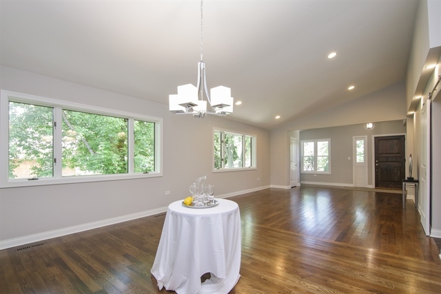 3015 Keystone Road Northbrook, IL 60062 - Photo 4 of 23 a view of an empty room with wooden floor and a window