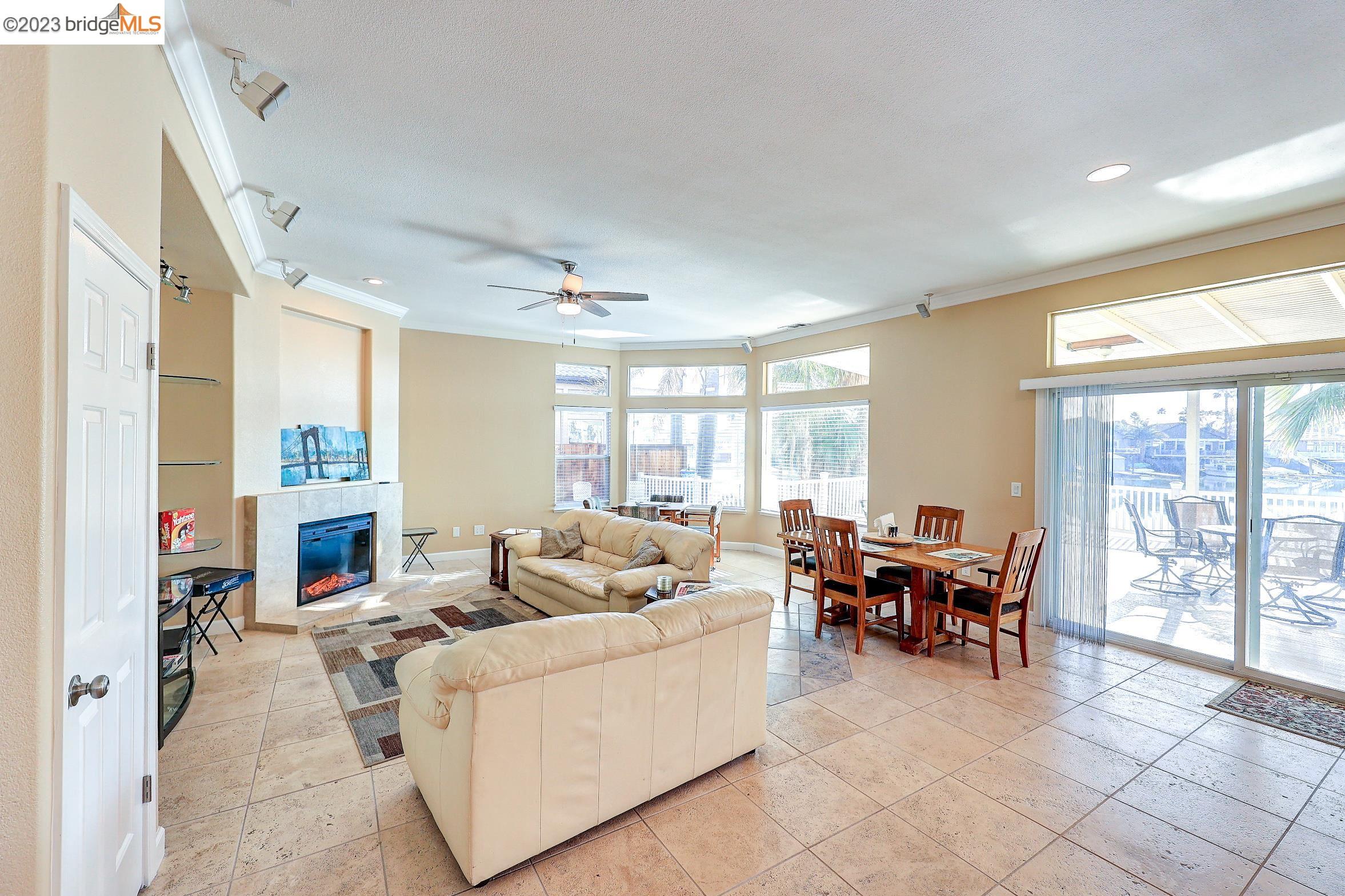 4050 Pier Point, Unit 100 Discovery Bay, CA 94505 - Photo 17 of 60 a living room with furniture and a fireplace