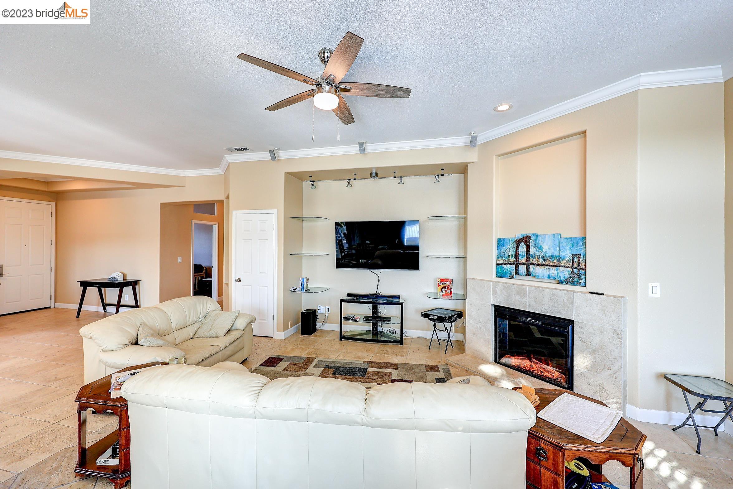4050 Pier Point, Unit 100 Discovery Bay, CA 94505 - Photo 20 of 60 a living room with furniture and a flat screen tv