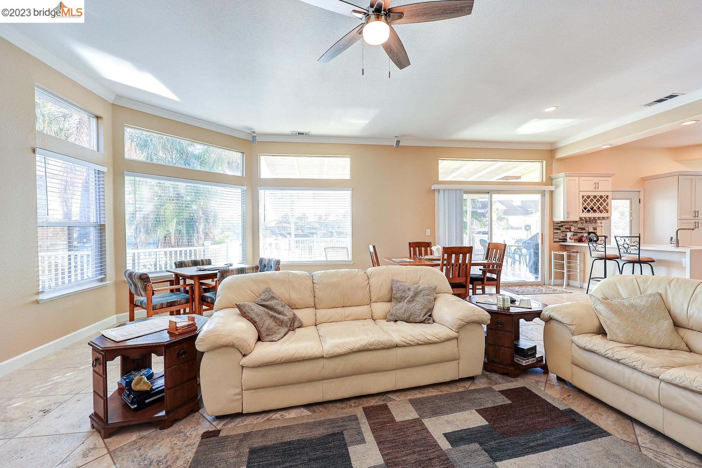 4050 Pier Point, Unit 100 Discovery Bay, CA 94505 - Photo 22 of 60 a living room with furniture and a large window