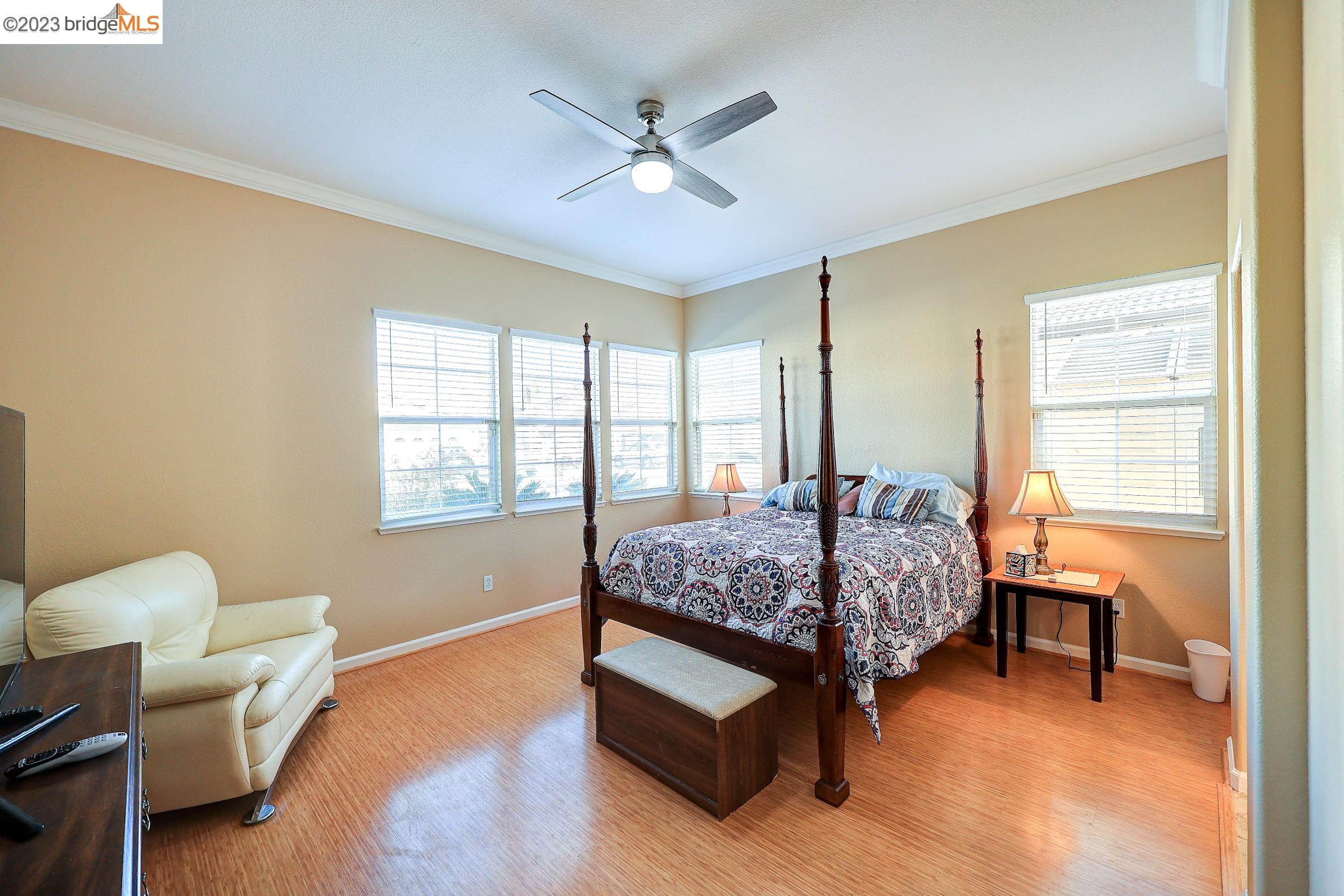 4050 Pier Point, Unit 100 Discovery Bay, CA 94505 - Photo 24 of 60 a bedroom with a bed and a window