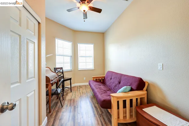 a bedroom with a bed and a lamp