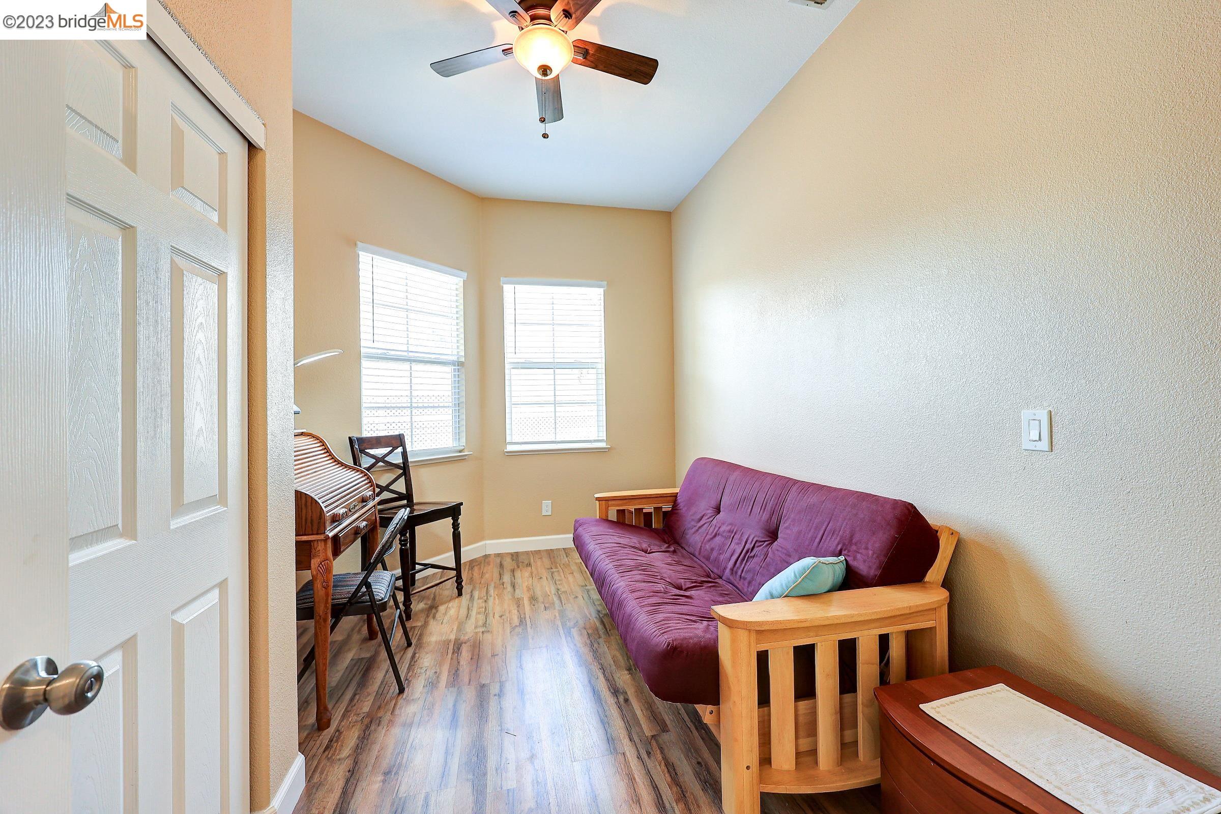 4050 Pier Point, Unit 100 Discovery Bay, CA 94505 - Photo 31 of 60 a living room with furniture a dining table and a chandelier
