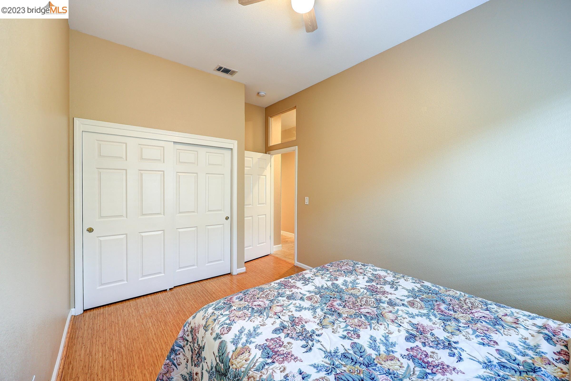 4050 Pier Point, Unit 100 Discovery Bay, CA 94505 - Photo 36 of 60 a bedroom with a bed and a window