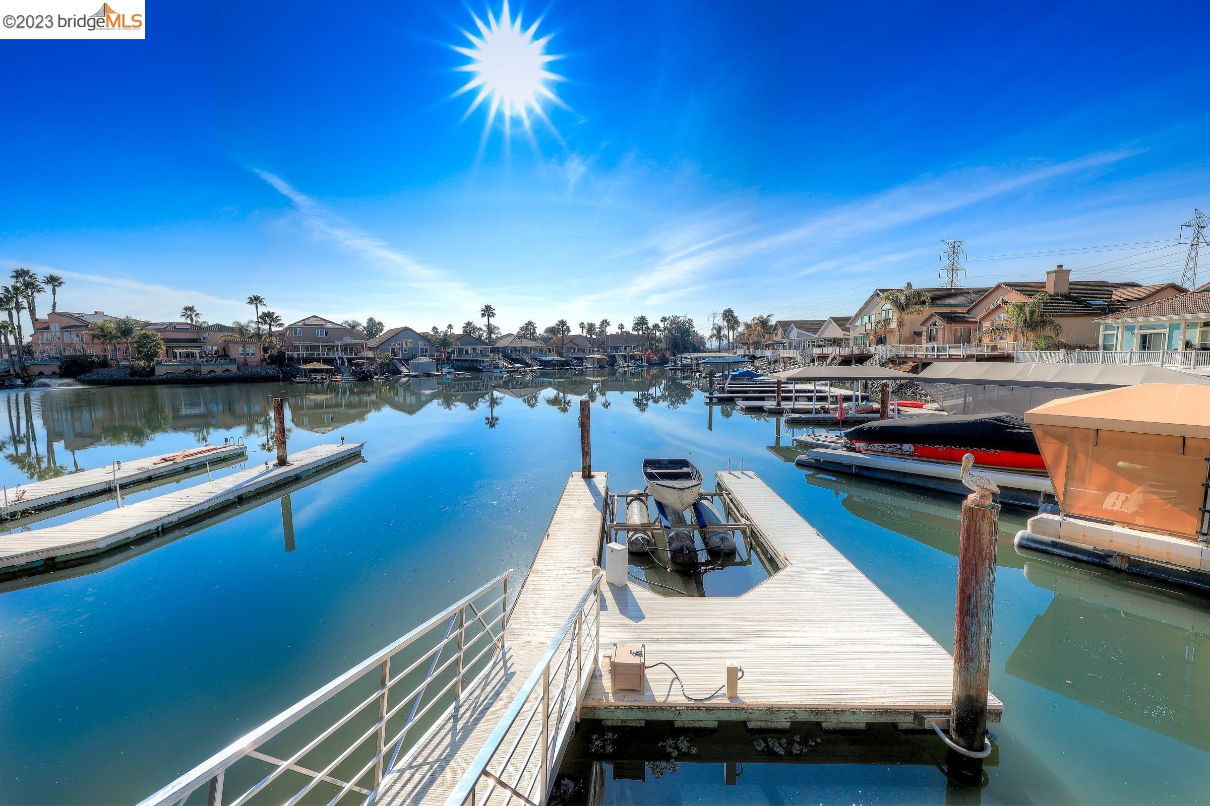 4050 Pier Point, Unit 100 Discovery Bay, CA 94505 - Photo 46 of 60 a view of a lake with houses