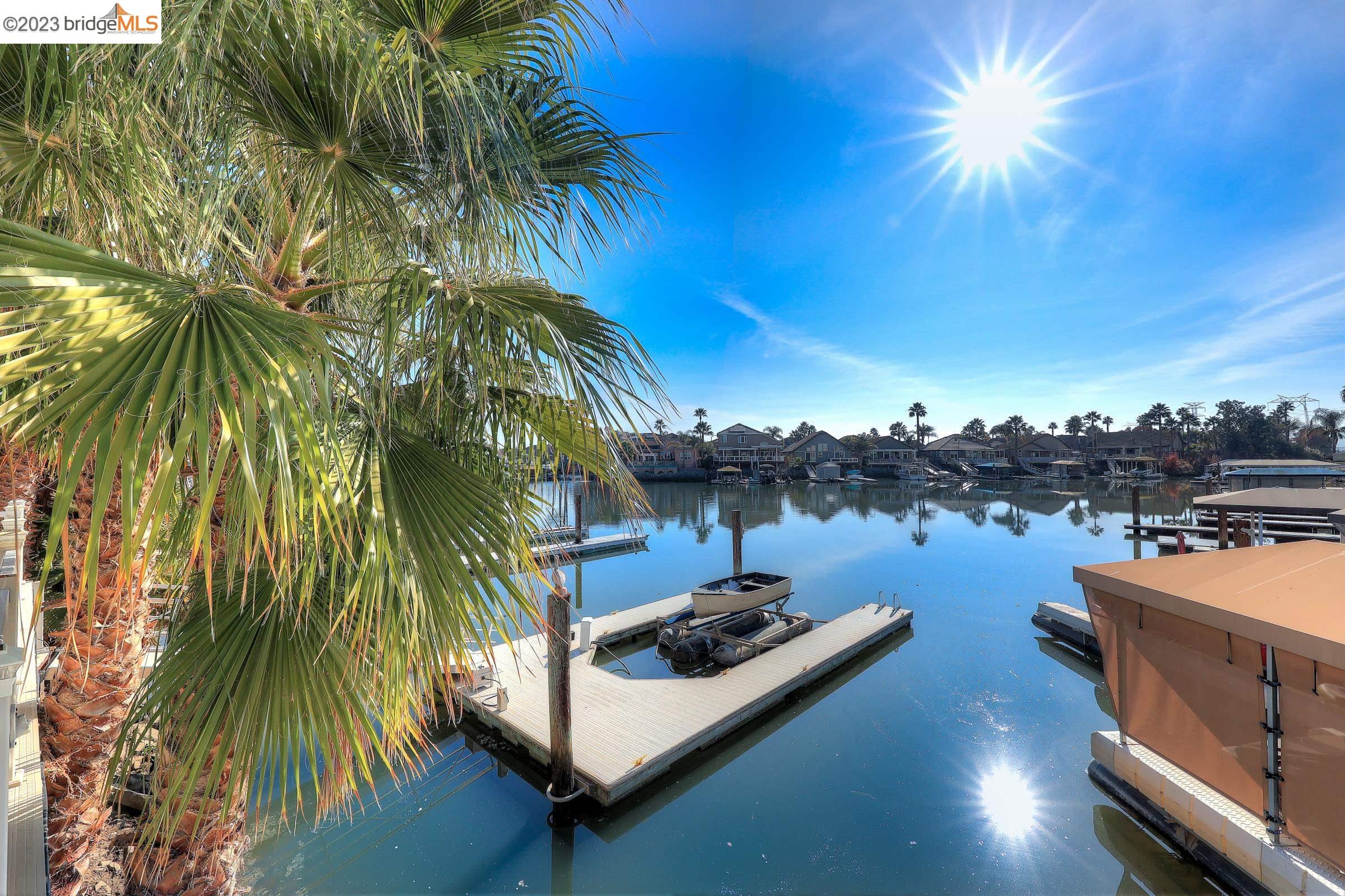 4050 Pier Point, Unit 100 Discovery Bay, CA 94505 - Photo 47 of 60 a backyard of a house with table and chairs