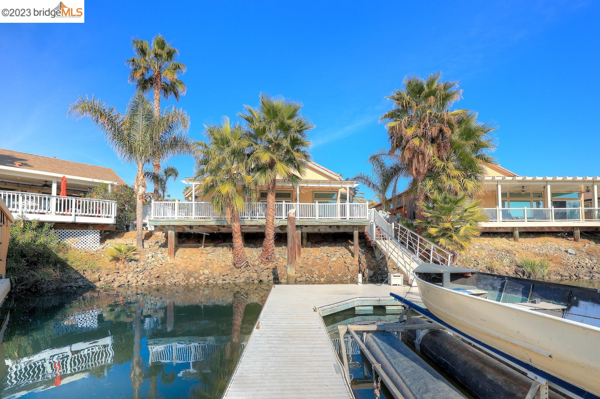 4050 Pier Point, Unit 100 Discovery Bay, CA 94505 - Photo 50 of 60 a front view of a house with a garden