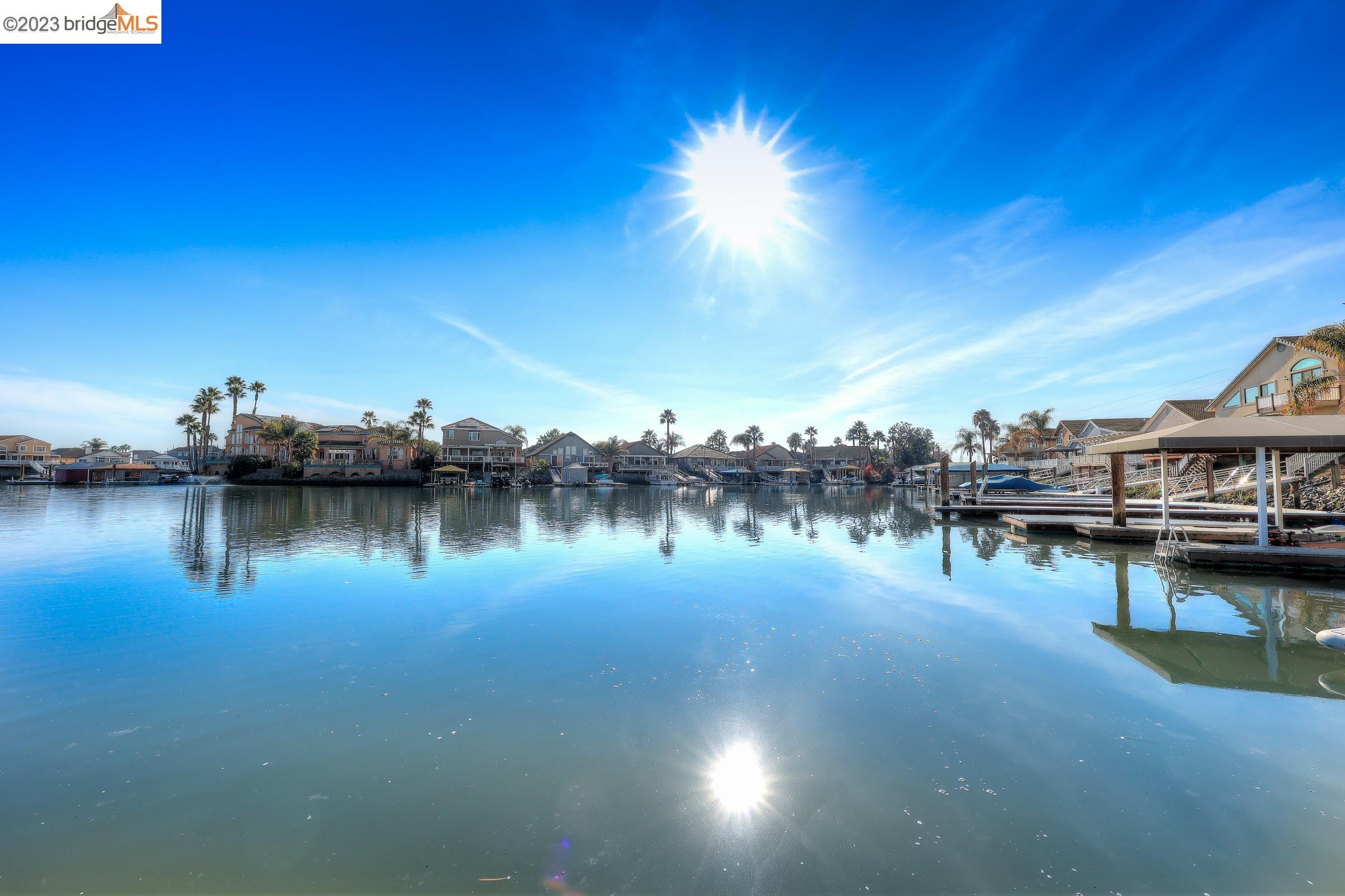 4050 Pier Point, Unit 100 Discovery Bay, CA 94505 - Photo 51 of 60 a view of a lake with houses