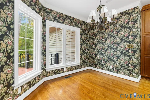 a view of a house with pool and sitting area