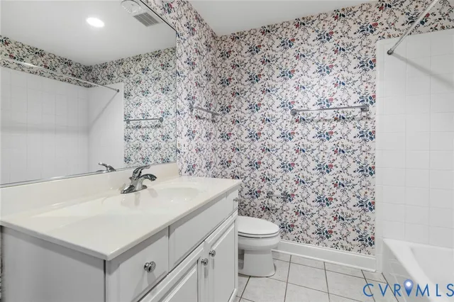 a bathroom with a sink toilet and vanity