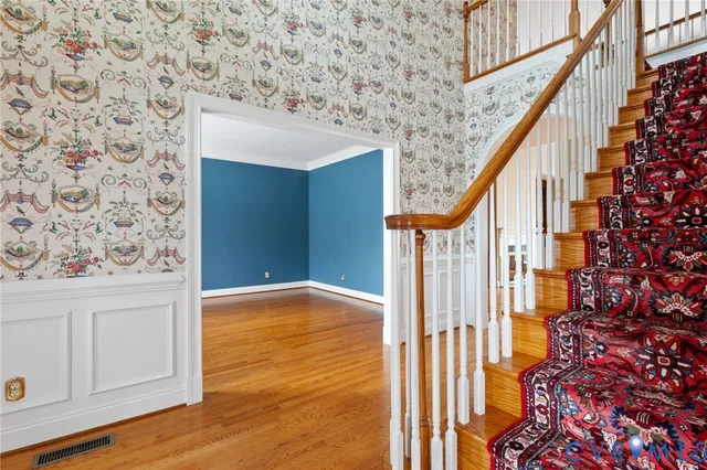 a view of entryway with wooden floor