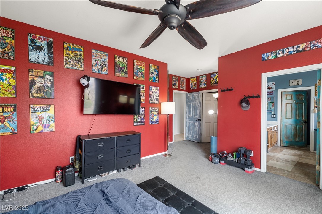 1131 South Blagg Road Pahrump, NV 89048 - Photo 17 of 30 Carpeted bedroom with ensuite bath and a ceiling fan