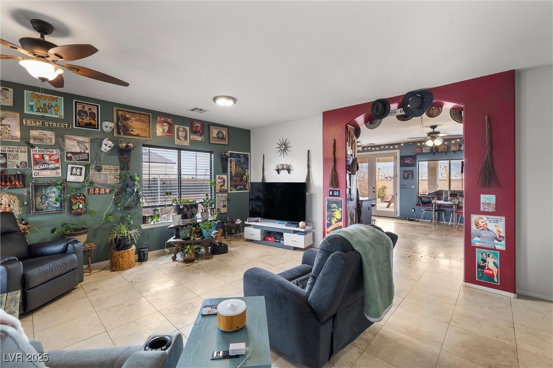 1131 South Blagg Road Pahrump, NV 89048 - Photo 4 of 30 Tiled living room featuring visible vents and ceiling fan