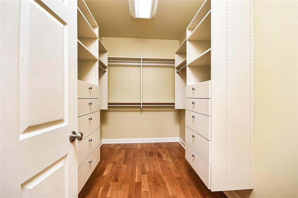 2865 Lenox Road Northeast, Unit 407 Atlanta, GA 30324 - Photo 16 of 27 a view of walk in closet with wooden floor