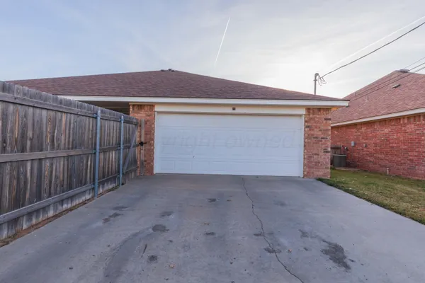 a view of backyard and garage