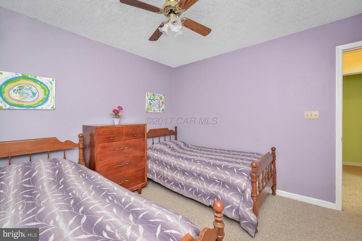 41 Sandyhook Road Ocean Pines, MD 21811 - Photo 14 of 21 a bedroom with a bed and a dresser in it