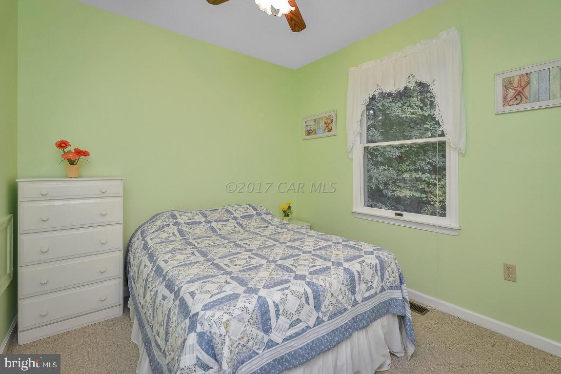 41 Sandyhook Road Ocean Pines, MD 21811 - Photo 17 of 21 a bedroom with a bed and a window