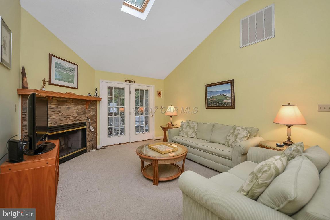 41 Sandyhook Road Ocean Pines, MD 21811 - Photo 3 of 21 a living room with furniture a fireplace and a flat screen tv