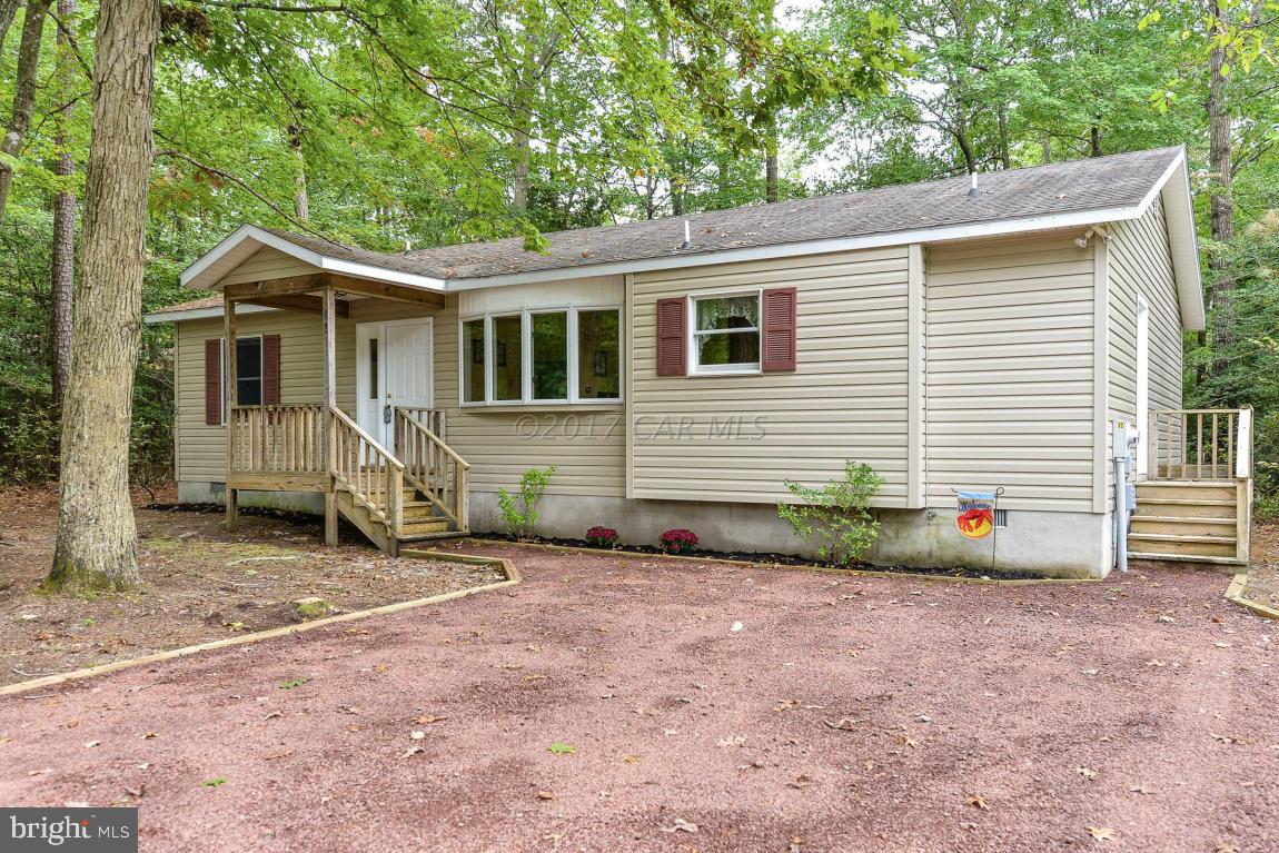 41 Sandyhook Road Ocean Pines, MD 21811 - Photo 21 of 21 a view of a house with a yard and potted plants