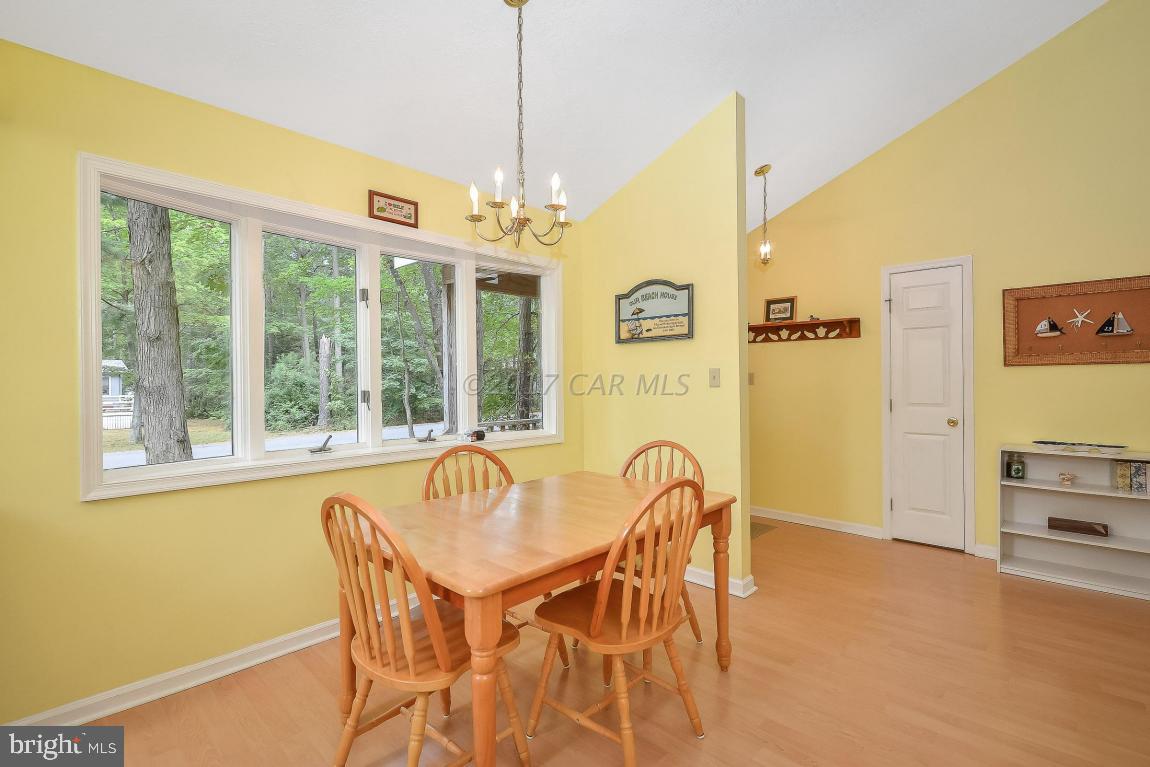 41 Sandyhook Road Ocean Pines, MD 21811 - Photo 5 of 21 a view of a dining room with furniture window and outside view