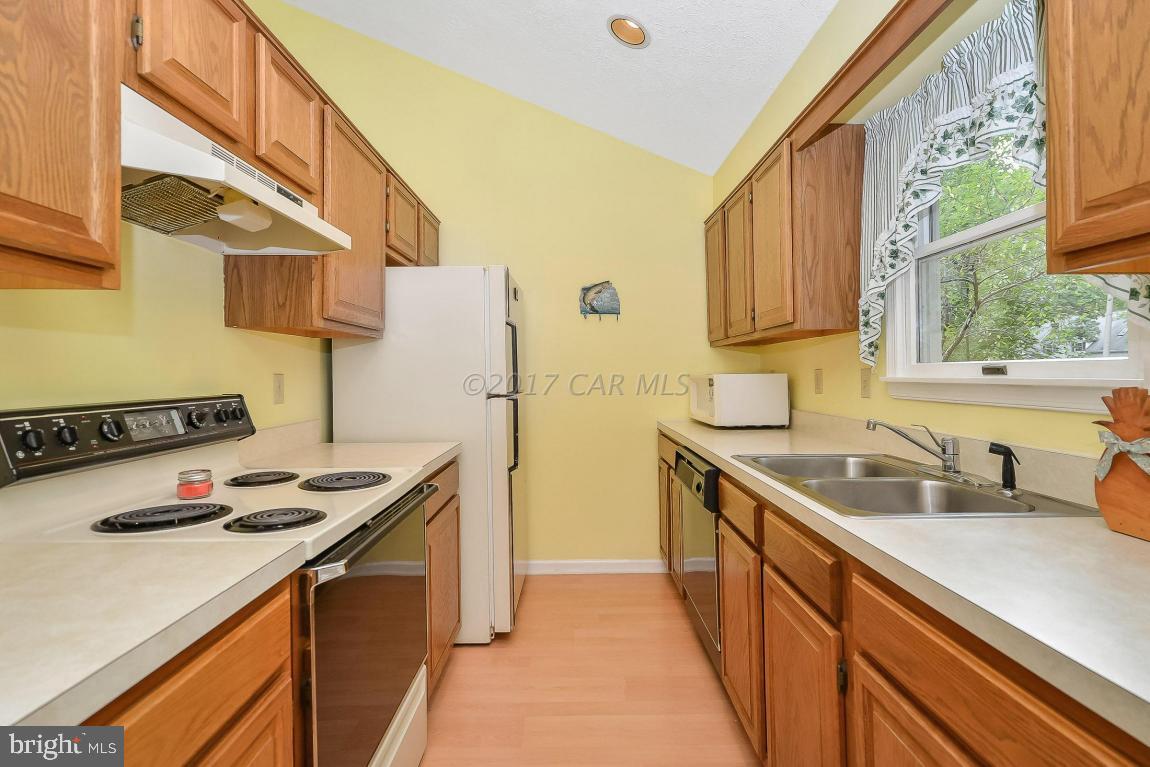 41 Sandyhook Road Ocean Pines, MD 21811 - Photo 7 of 21 a kitchen with stainless steel appliances a sink stove and refrigerator