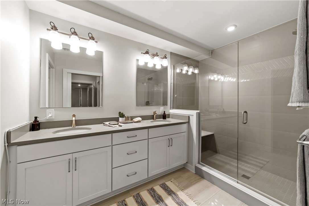 2044 Random Road, Unit 101 Cleveland, OH 44106 - Photo 20 of 44 Bathroom featuring a shower with shower door and double sink vanity