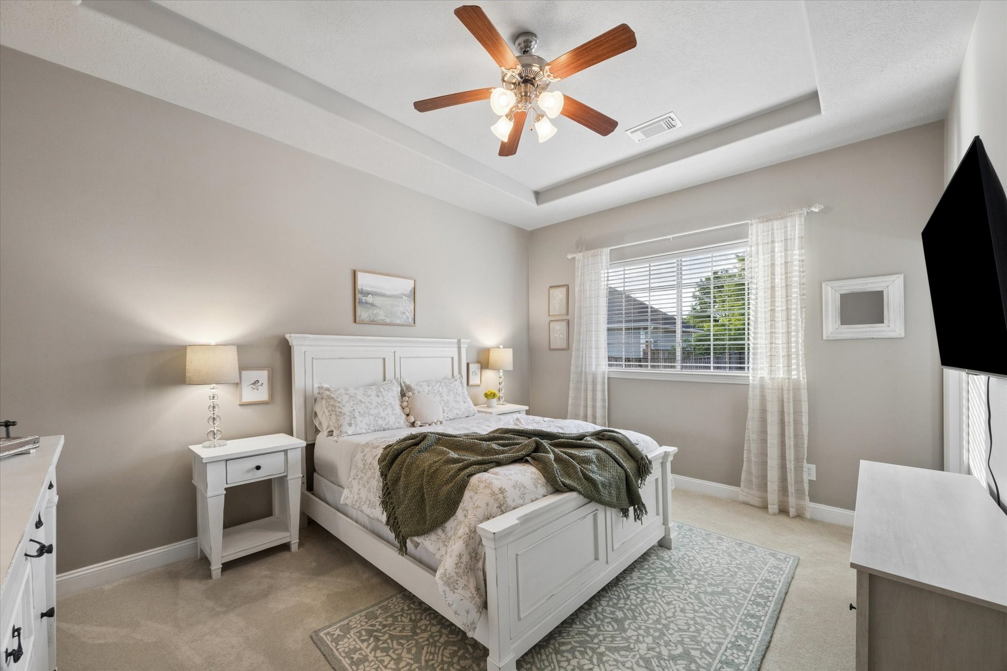 16519 Deerhaven Run Rosharon, TX 77583 - Photo 20 of 47 a bedroom with a bed and a flat screen tv