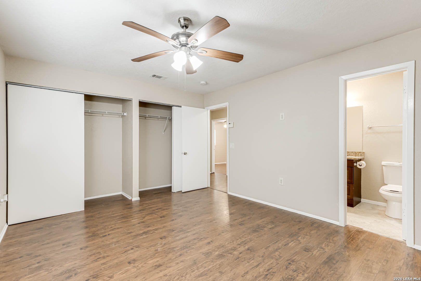 112 Friendswood Path Universal City, TX 78148 - Photo 17 of 31 a view of a big room with wooden floor and bathroom view