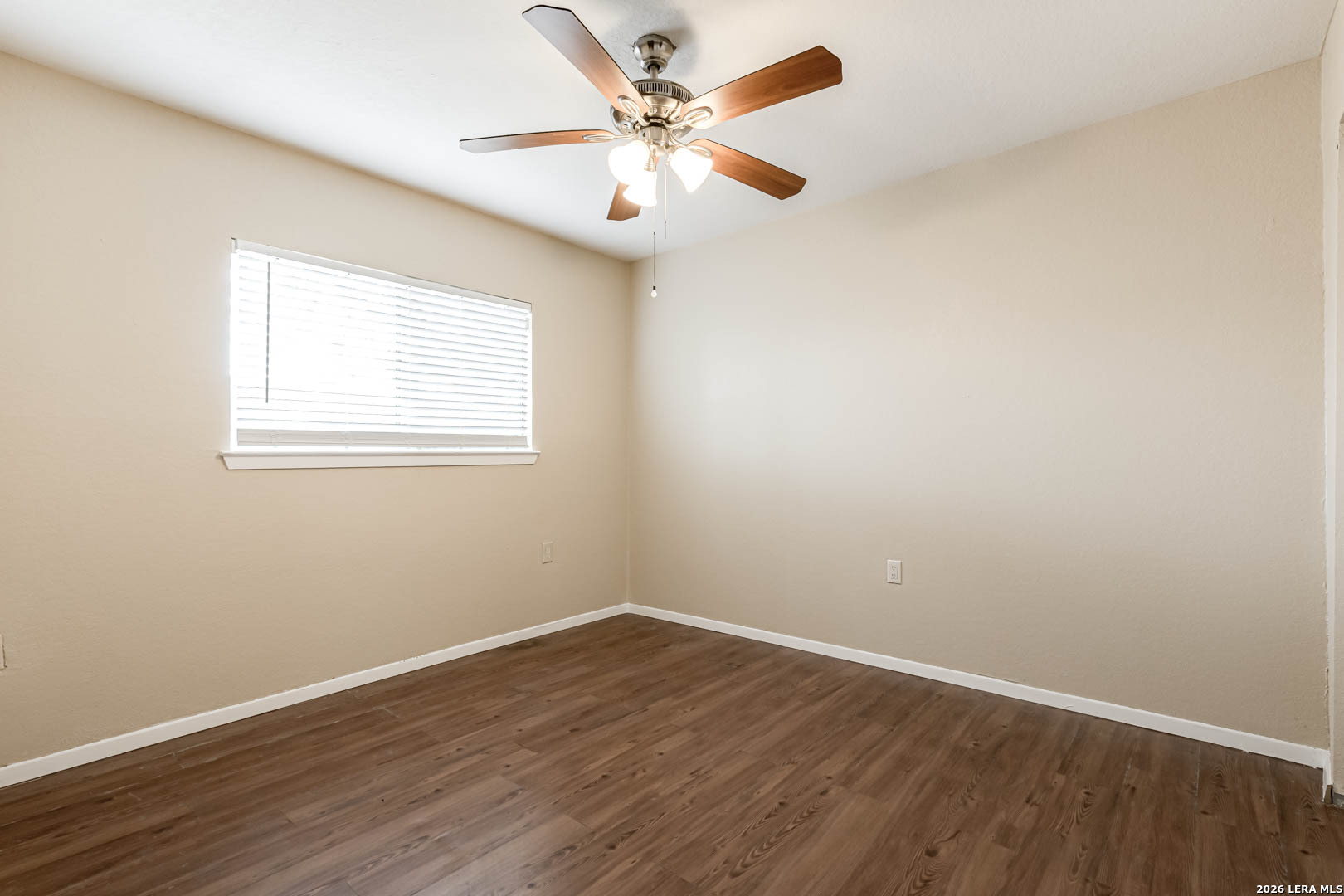 112 Friendswood Path Universal City, TX 78148 - Photo 20 of 31 an empty room with wooden floor and windows