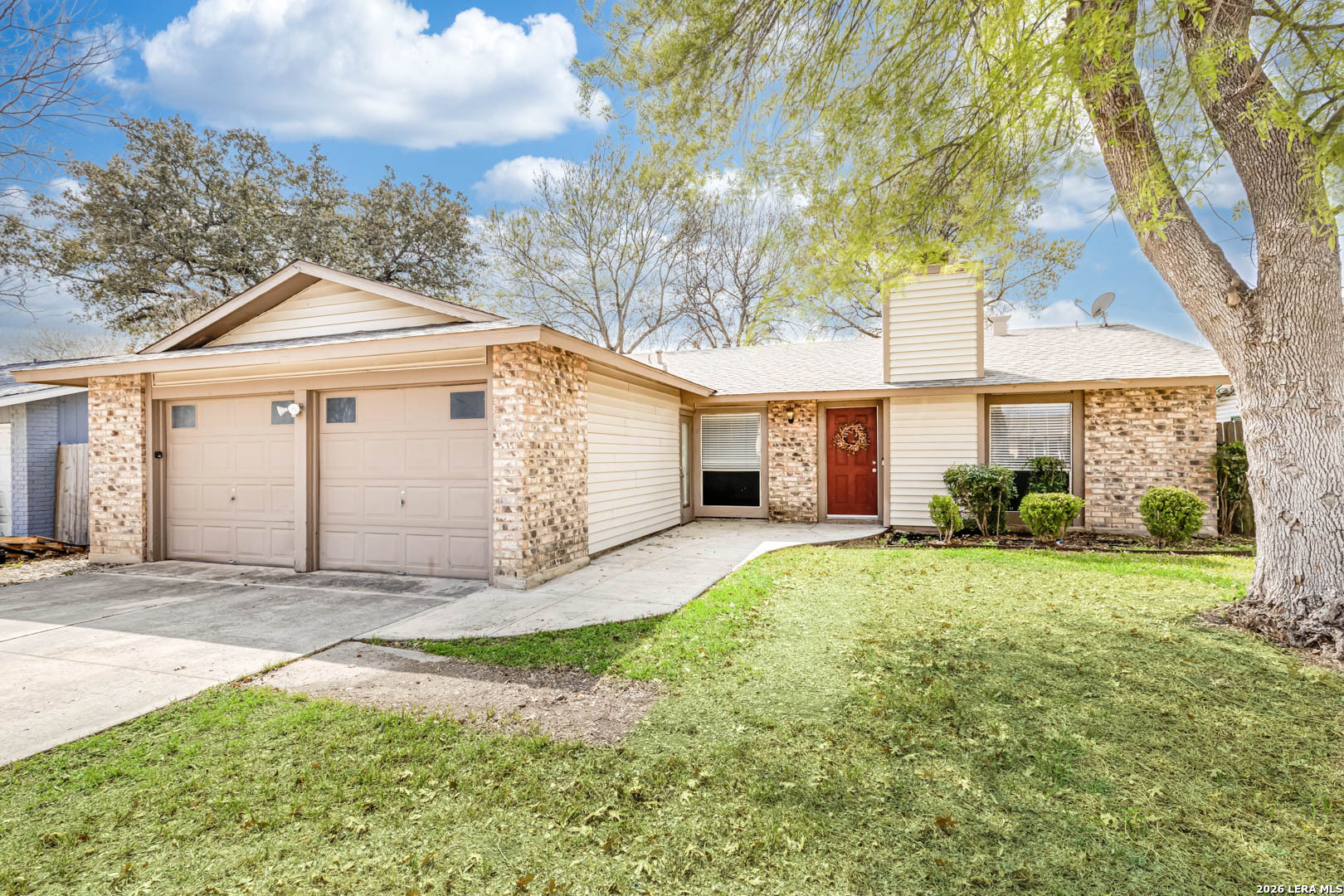 112 Friendswood Path Universal City, TX 78148 - Photo 2 of 31 a front view of a house with a yard and garage