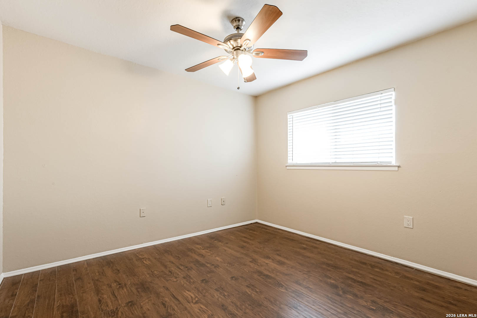 112 Friendswood Path Universal City, TX 78148 - Photo 22 of 31 an empty room with wooden floor and windows