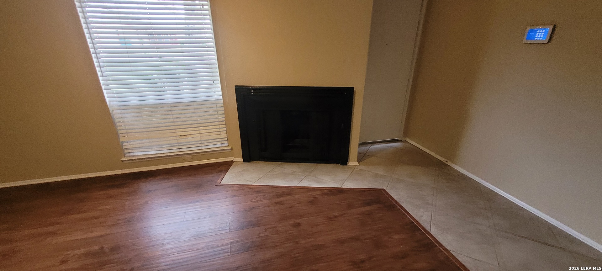 112 Friendswood Path Universal City, TX 78148 - Photo 5 of 8 a view of an empty room with wooden floor