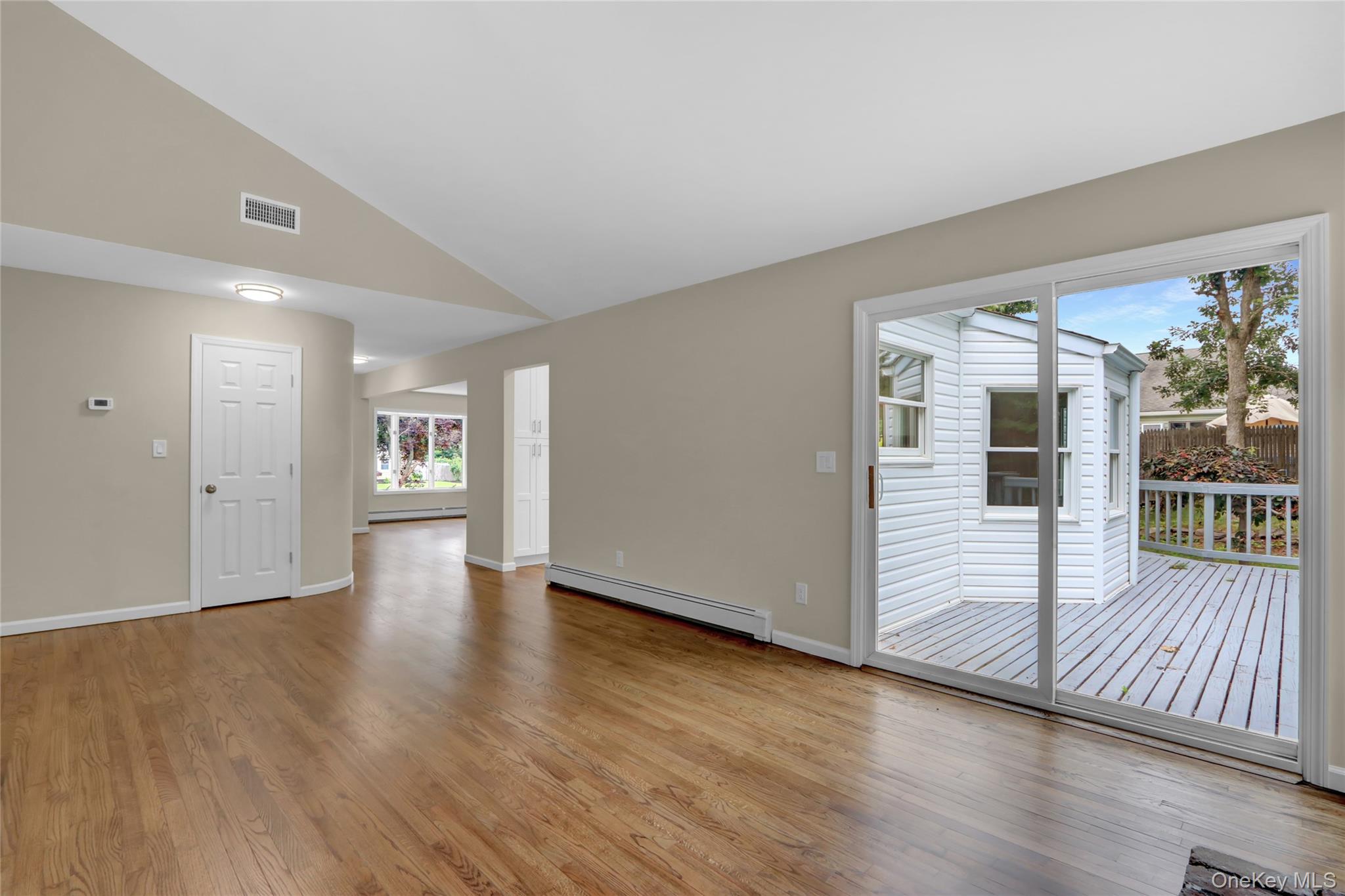 181 Wading River Hollow Road Ridge, NY 11961 - Photo 12 of 24 wooden floor in an empty room with a window