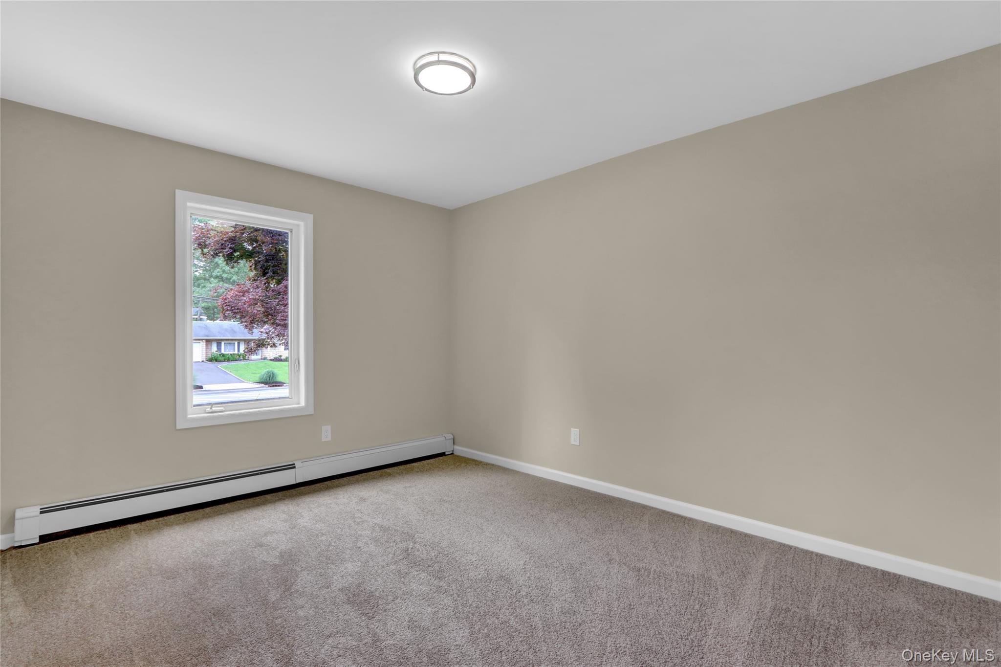 181 Wading River Hollow Road Ridge, NY 11961 - Photo 14 of 24 an empty room with a window
