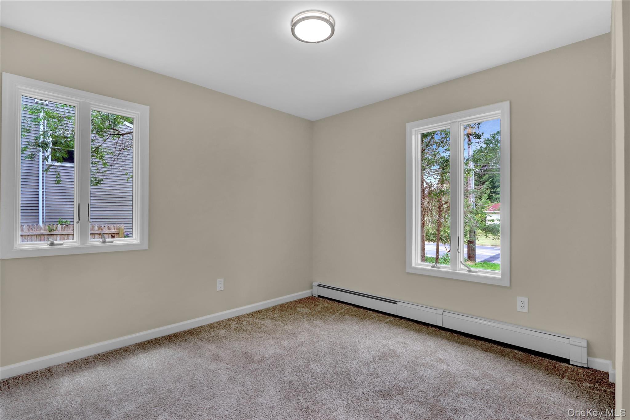 181 Wading River Hollow Road Ridge, NY 11961 - Photo 15 of 24 an empty room with windows