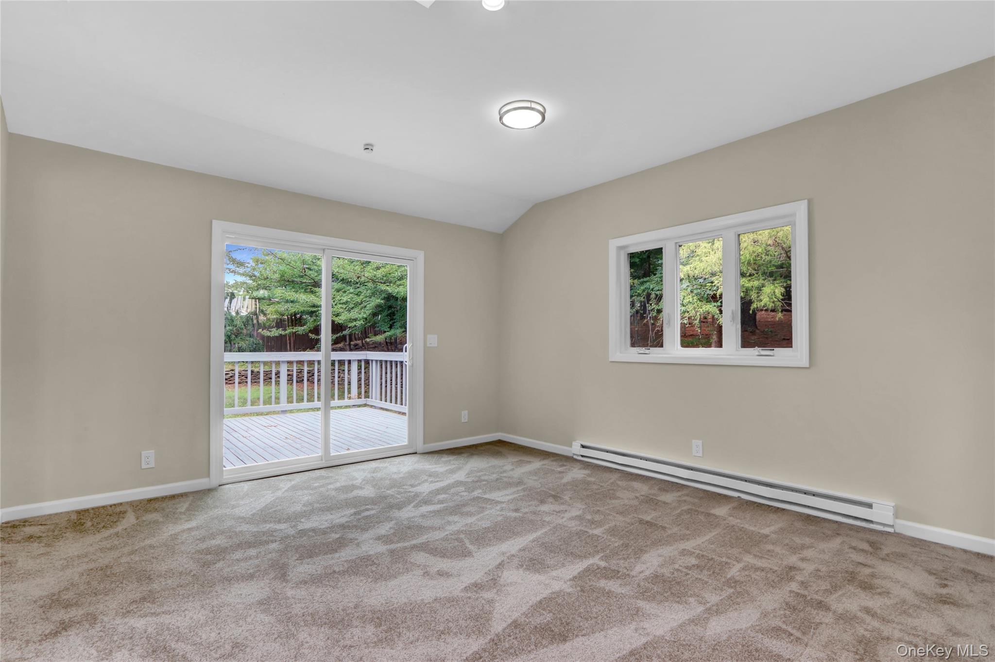 181 Wading River Hollow Road Ridge, NY 11961 - Photo 18 of 24 a view of an empty room with a window