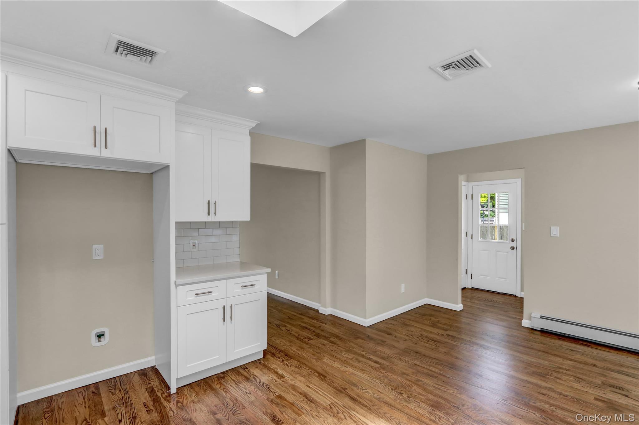 181 Wading River Hollow Road Ridge, NY 11961 - Photo 10 of 24 a view of a kitchen with wooden floor