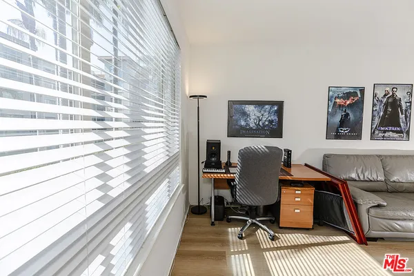 a workspace with furniture and a rug
