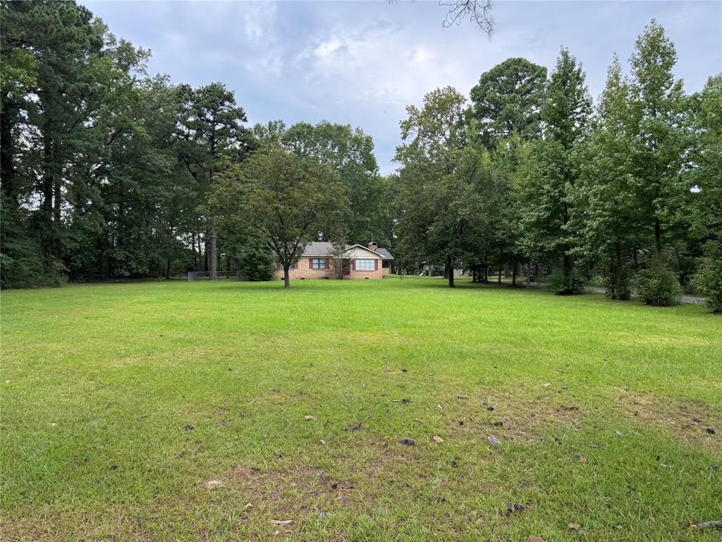 312 North Elm Street Haughton, LA 71037 - Photo 2 of 2 a view of a green field with trees in the background