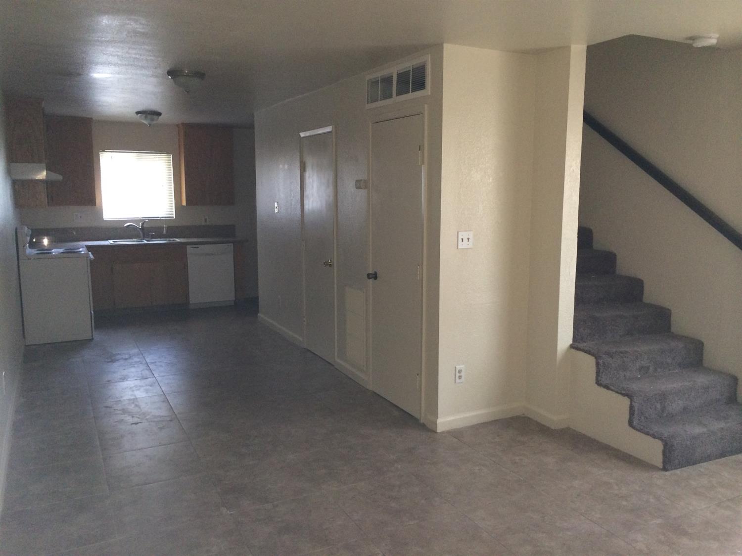 2800 Prescott Road Modesto, CA 95350 - Photo 3 of 13 an empty room with windows and fireplace