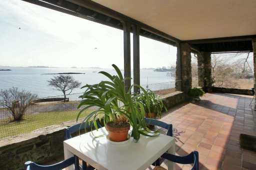 Undisclosed Address Norwalk, CT 06854 - Photo 6 of 8 a view of a swimming pool with a lounge chair