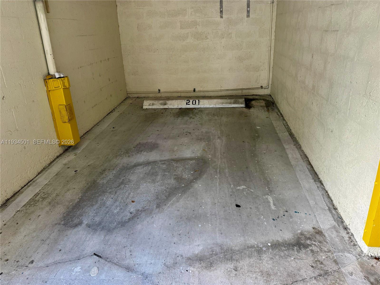 8430 Southwest 8th Street, Unit 201B Miami, FL 33144 - Photo 14 of 14 a view of a room with wooden floor