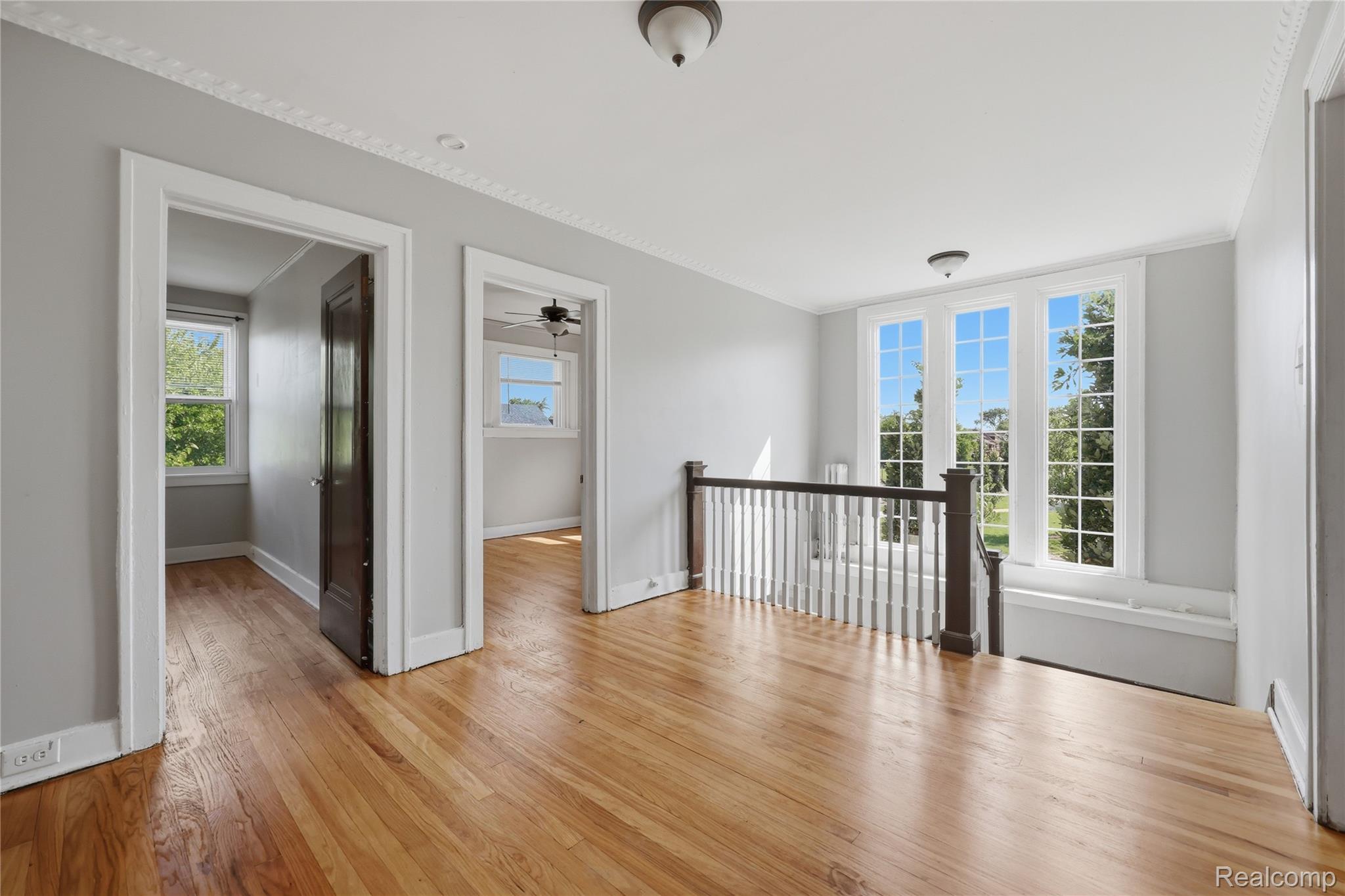 1945 Atkinson Street Detroit, MI 48206 - Photo 22 of 49 Wood-finish flooring throughout this open landing area with a decorative crown molding ceiling