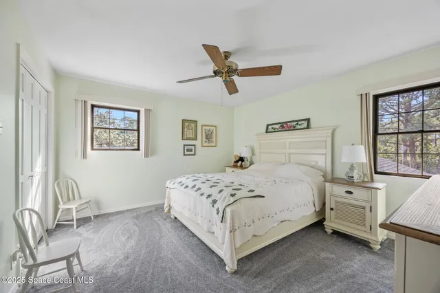 a bedroom with a bed and a table