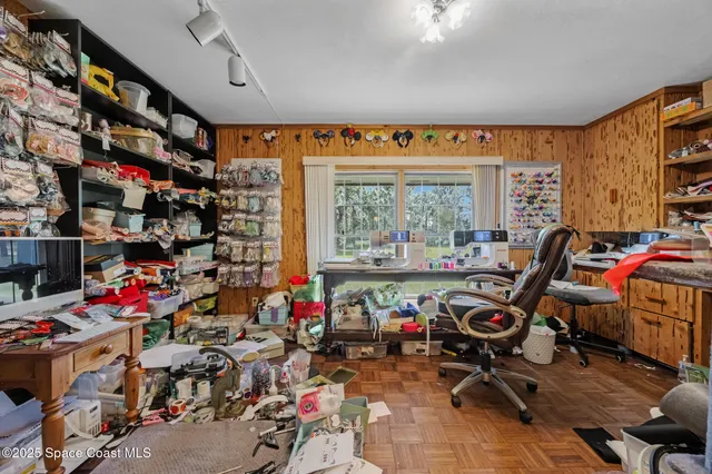 a very nice looking room with many windows and furniture