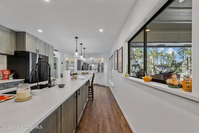 a kitchen with counter top space and stainless steel appliances