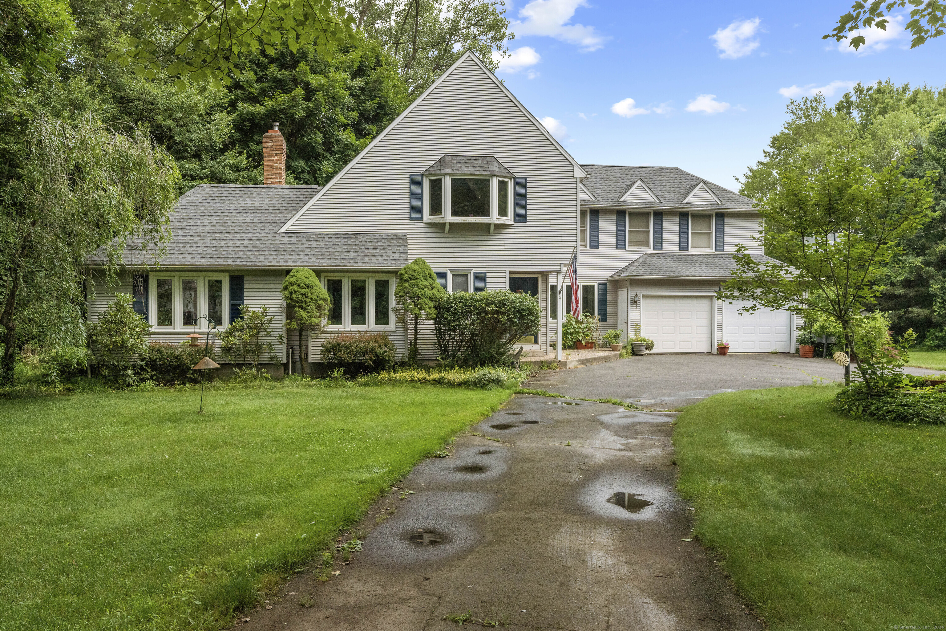 9 Bailey Road Enfield, CT 06082 - Photo 1 of 1 a front view of a house with a yard and garage