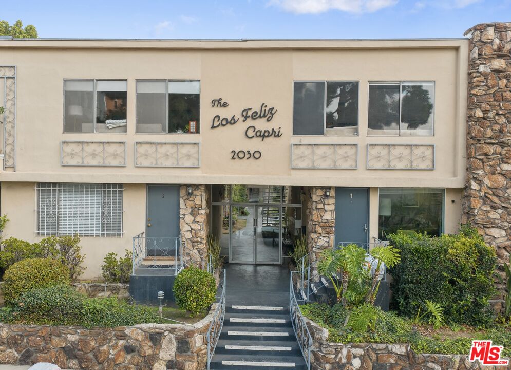 2030 North Vermont Avenue, Unit 6 Los Angeles, CA 90027 - Photo 2 of 25 a front view of a house with a yard