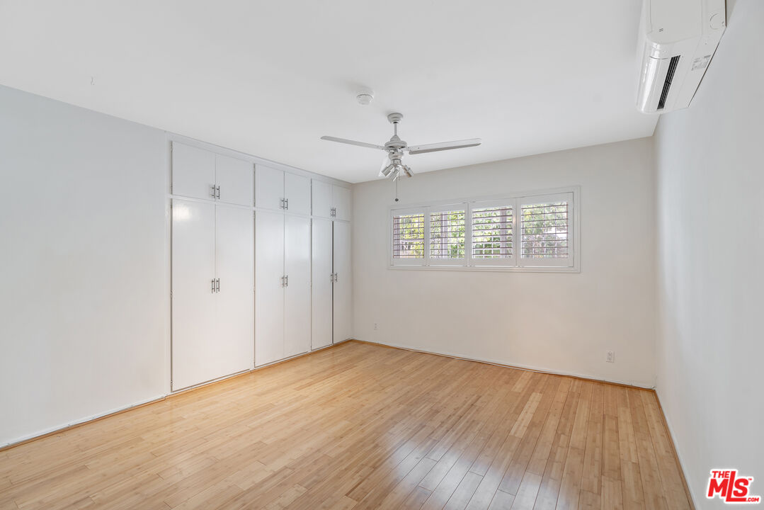 2030 North Vermont Avenue, Unit 6 Los Angeles, CA 90027 - Photo 23 of 25 a view of an empty room with wooden floor and a window